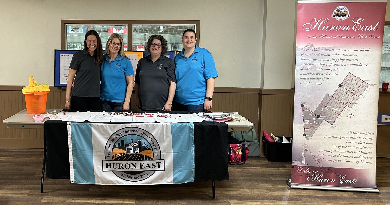 A picture of four Huron East employees at the 2024 Job Fair.