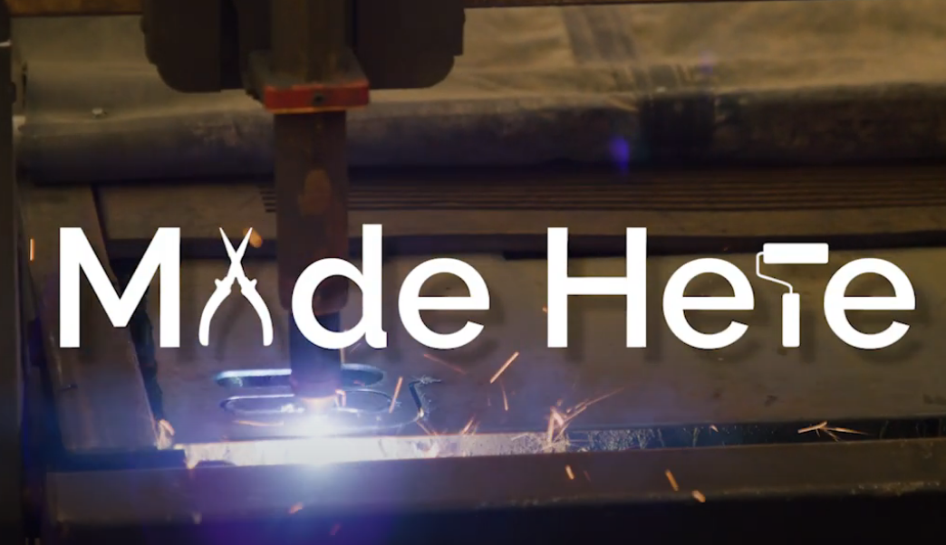 A picture of steel getting cut with overlaying text that says "Made Here".